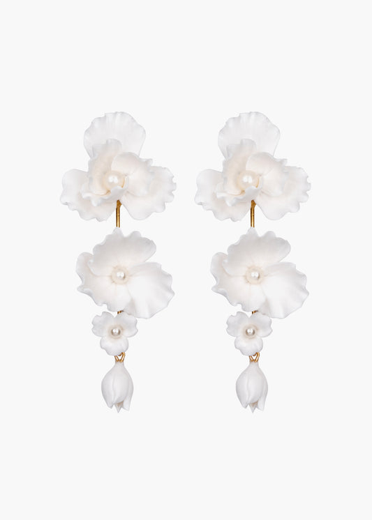 Pair of white floral earrings on a white background
